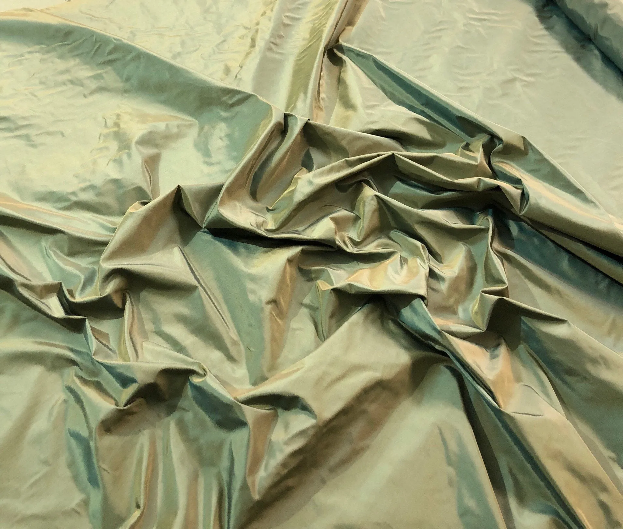 Silk taffeta 54&quot; wide    Beautiful iridescent green gold silk taffeta fabric sold by the yard